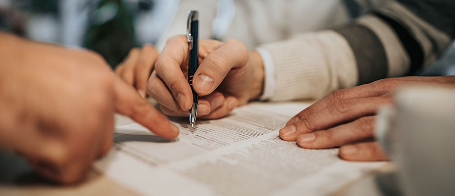 Signing a mortgage document
